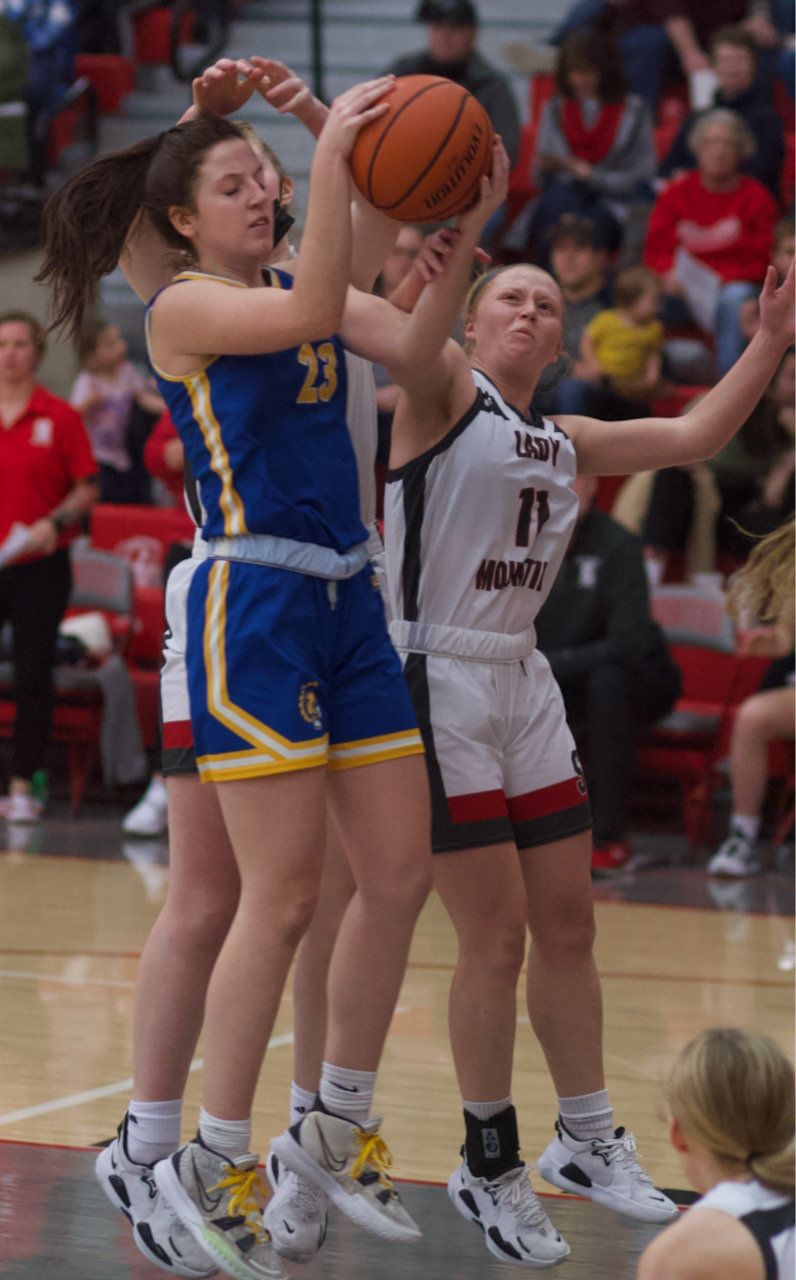 Sophomore Taylor Abston pulls down a rebound with Hanna Nichols flying in.